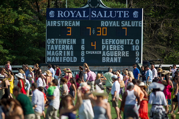 Spectators-divot-stomp-at-the-Greenwich-Polo-Clubs-Royal-Salute-Jubilee-Cup- match